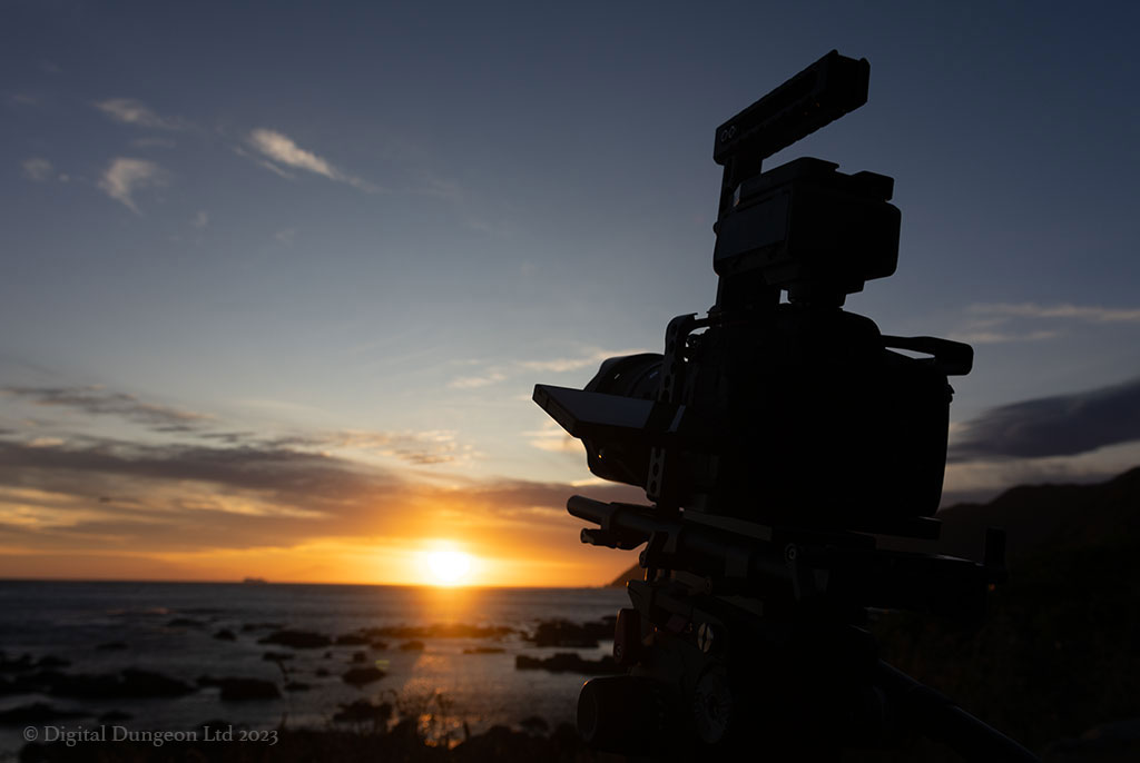 video camera pointing into sunset